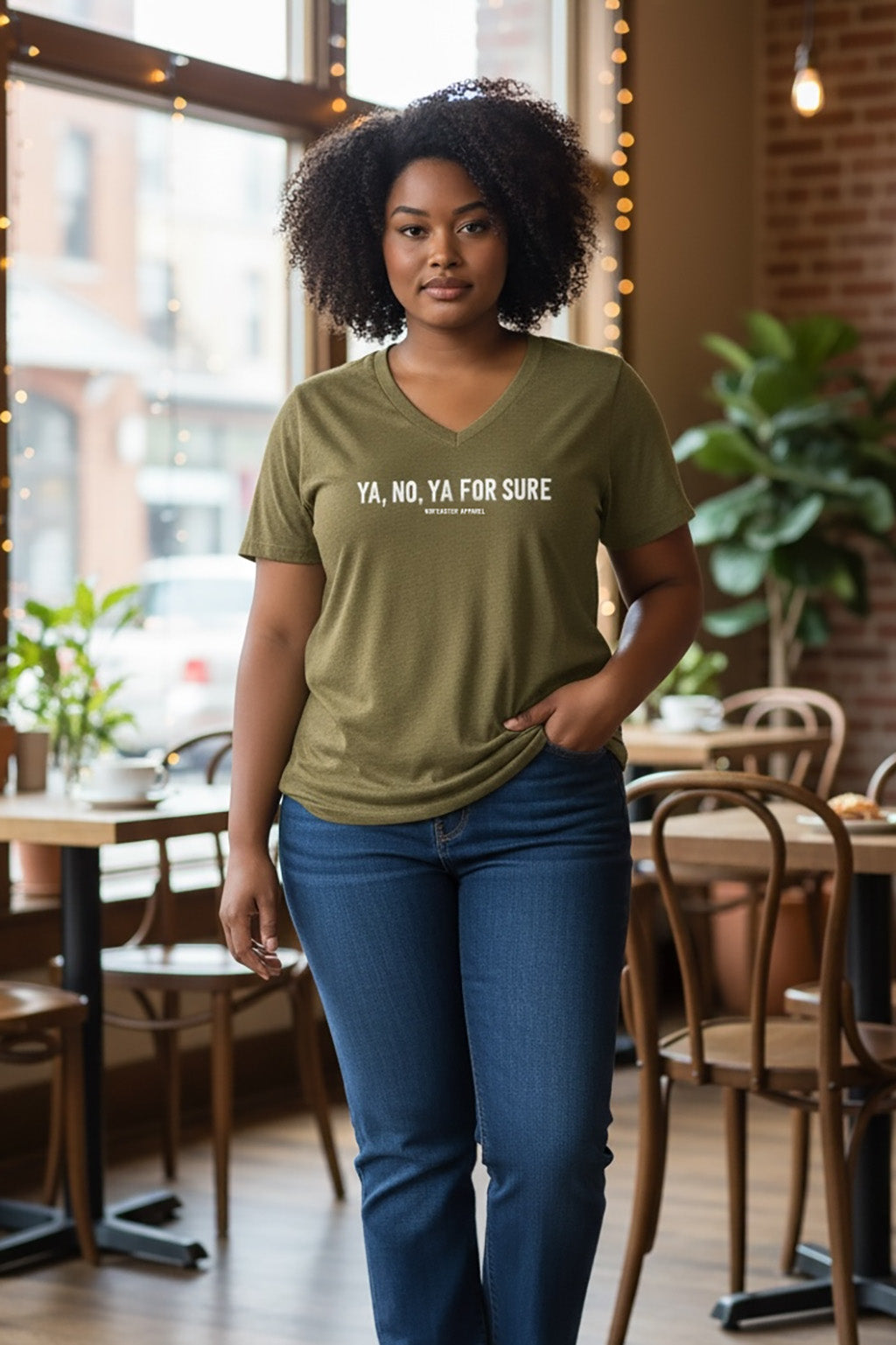 Woman wearing a green t-shirt with text in a casual setting