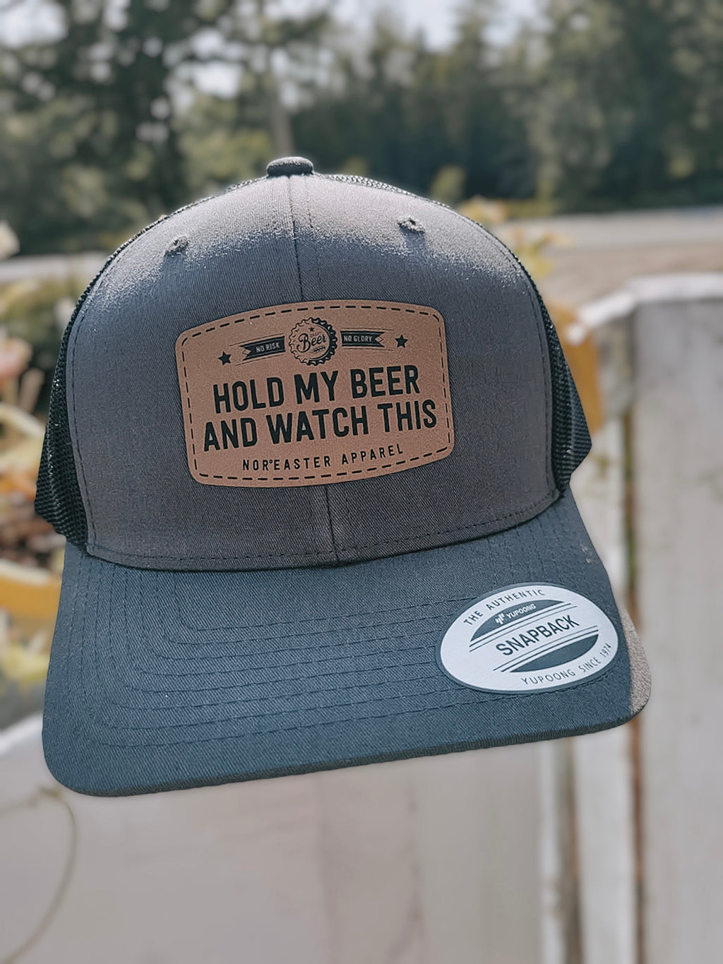 Hold my beer and watch this, heather grey hat with a back back, front view
