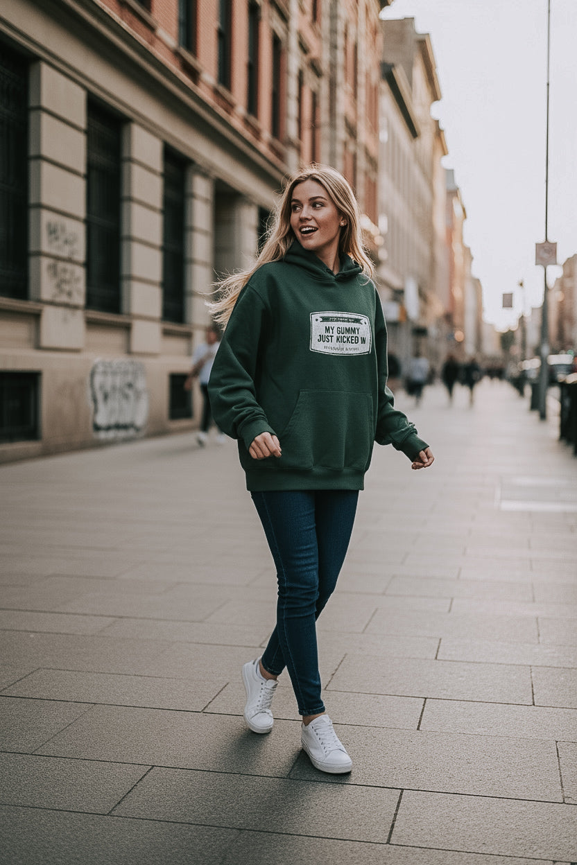 My gummy just kicked in green hoodie with white graphic, front view full body on a woman