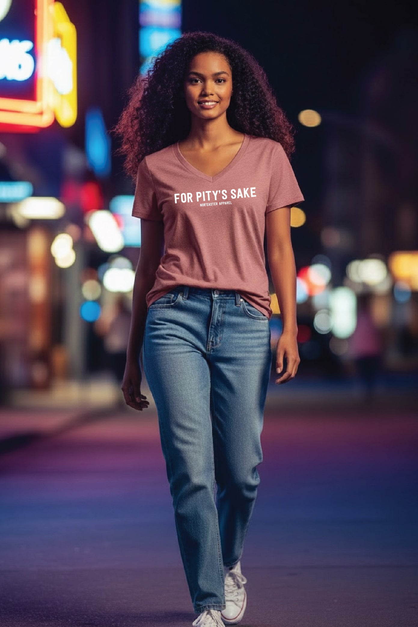 woman in a t-shirt on the sidewalk at night for pitty's sake