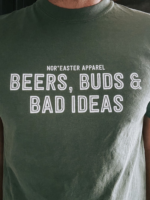 Green t-shirt with text 'BEERS, BUDS & BAD IDEAS' on a dark background