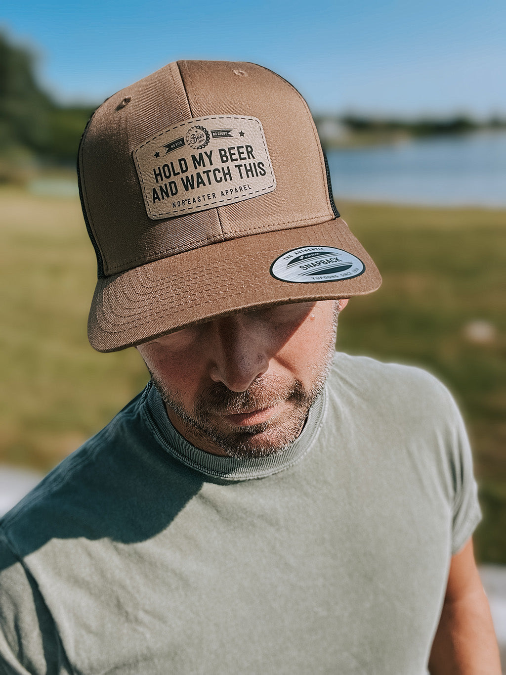 Nor'easter Apparel hold my beer hat in brown worn by a guy