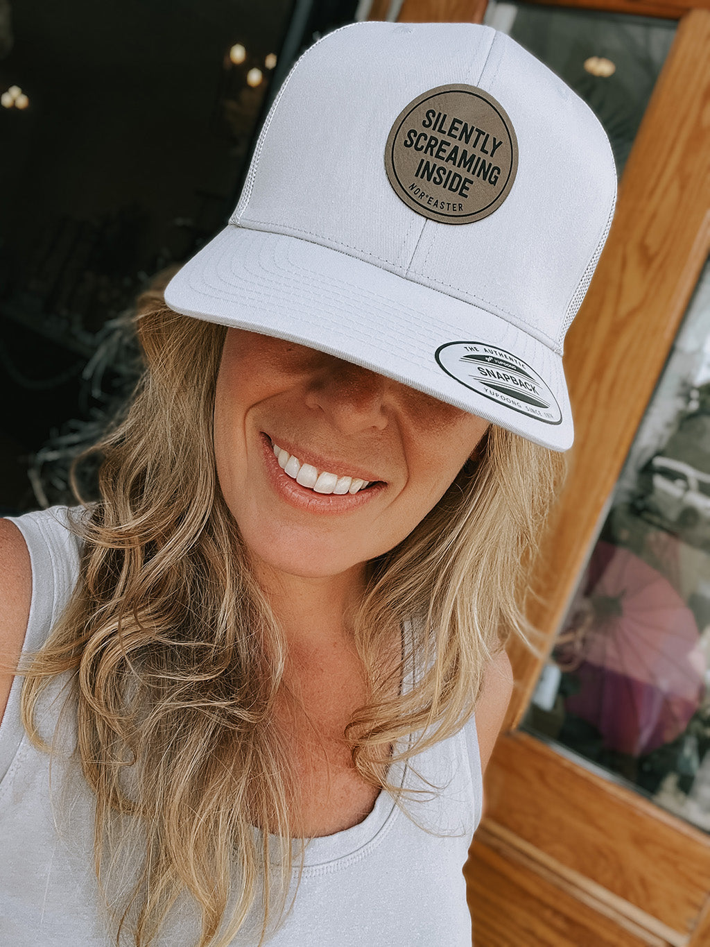 silently screaming inside hat on a woman front view